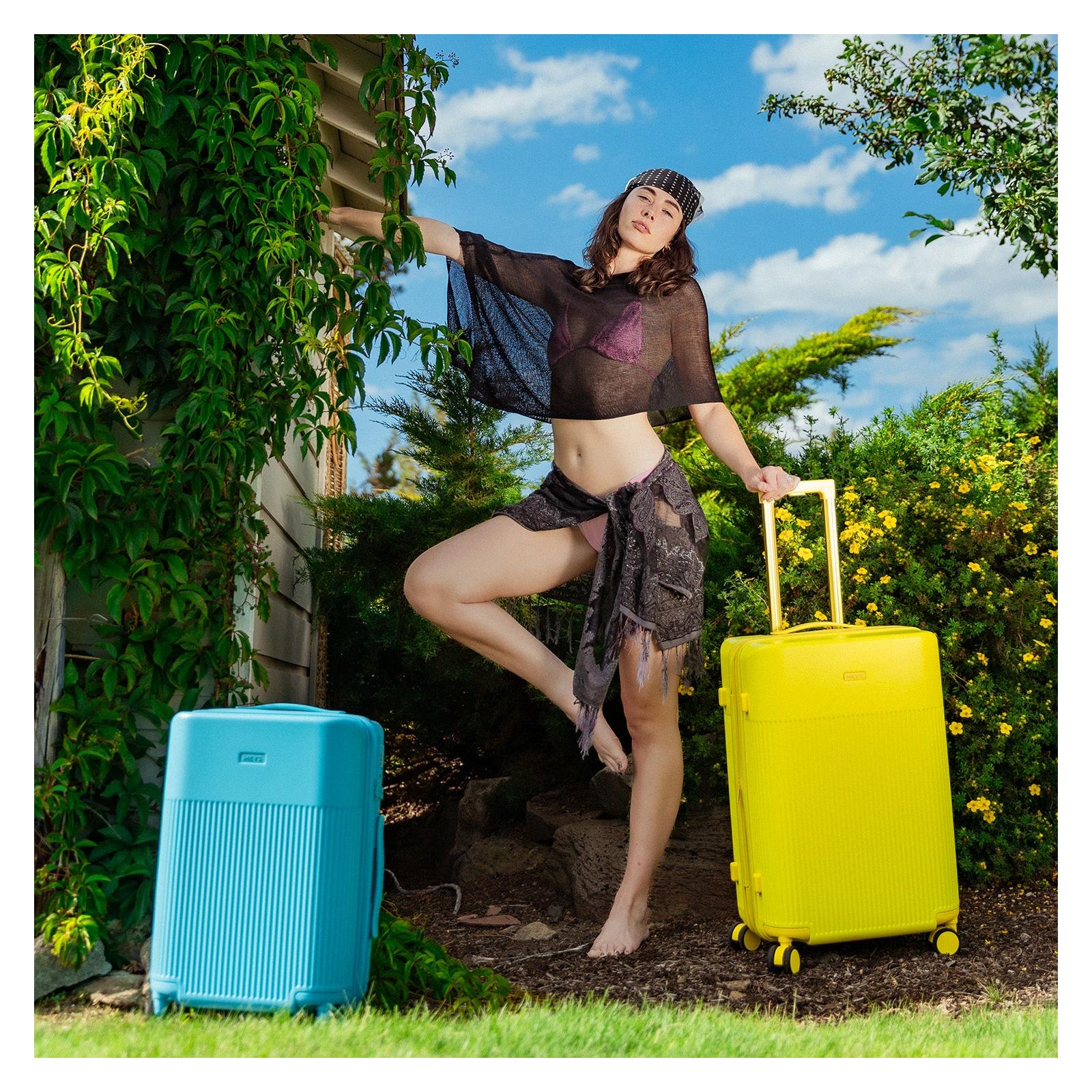 Střední cestovní kufr na kolečkách Heys HiLite M Sunburst Yellow